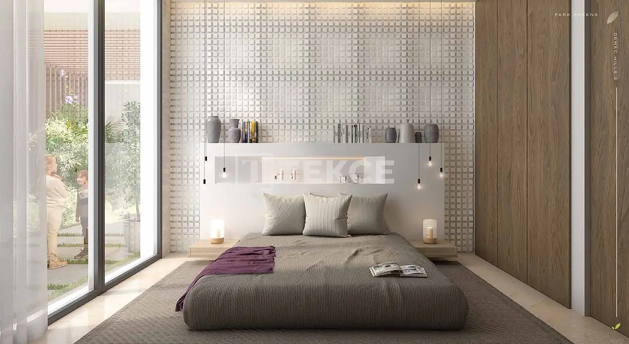 Bedroom with floor-to-ceiling windows in Park Greens 3 villa, DAMAC Hills 2